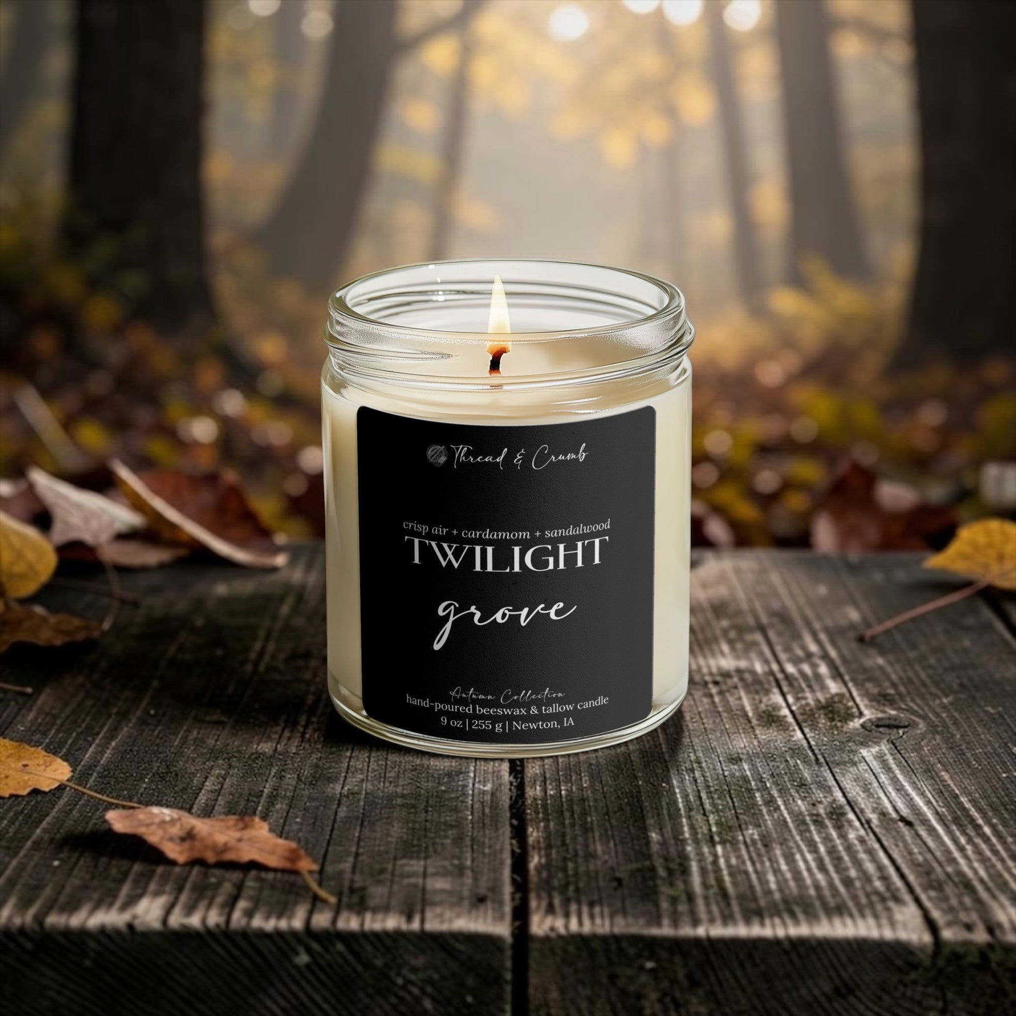 Twilight Grove fall beeswax and tallow candle with crisp air, cardamom and sandalwood fragrance notes in an autumn forest setting.